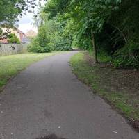 Keep following the path. Wide level Pavement, slight incline