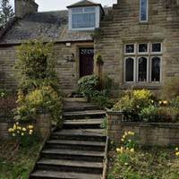 When you reach the houses on your right, opposite the house "Glenburn" (pictured) take the left path off the road with the gate.