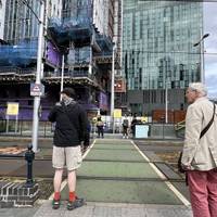 Cross over the tramway. Check both ways! Turn left on the other side to continue across the next tramway.