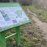 Once you’ve finished looking around the pond, you will see an information board. Follow the trail to the right.