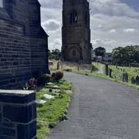 Following the path around the church and along past the old church tower