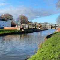 Shortly you’ll be arriving at a footbridge over the water. Continue on.