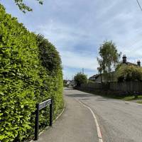 Cross the main road when safe to do so and head down Bakers Lane on the left hand pavement.