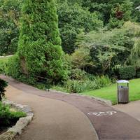 Turn left to follow the shared path across the bridge.