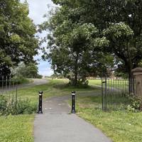 Take the path to your right between the bollards and enter the park.
