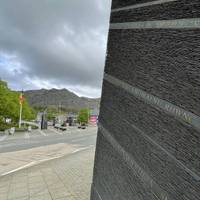 Head through the large slate pillars, celebrating the town's history as a slate mining centre.