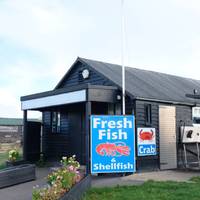 On the right you’ll also notice lots of huts selling fresh, locally caught fish.