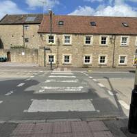 Use the zebra crossing in front of the town hall to cross Christchurch Street West.