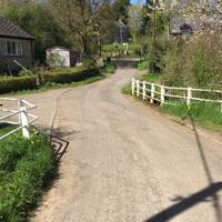 Cross the white bridge and keep right