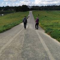 Proceed ahead down the paved but initially somewhat steep slope.