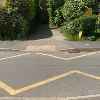 There are dropped kerbs either side of the road to ensure an easy crossing for those with accessibility needs.