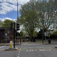 Carefully cross the main road at the pedestrian crossing on the left.
