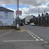At the end of the road, turn left and cross over the side road and head along Railway Road.