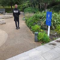 Turn right onto the compacted gravel path past the first planted area, following the sign towards the Blue Peter Garden.