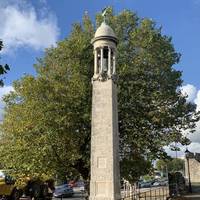 The column on your left is The Mayflower Memorial, commemorating the sailing of the pilgrim fathers to America.