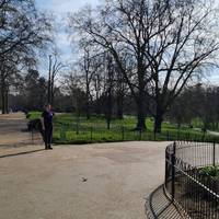 We'll take a right out of the cafe entrance, and another right to walk along the back of the building. The path is wide and smooth here.