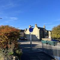 Use the drop kerbs to cross over the side roads. Mind any traffic as you go. The road soon turns into Priestpopple.