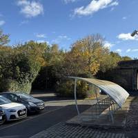 Turn right and walk alongside the carpark and past the bike rack.