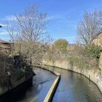 Look over the bridge to catch the first glimpse of the Wandle.