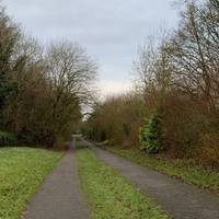 Continue walking between Palmerston Way and the outer edge of Knighton Park.