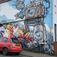 On the corner of Horley Road there’s a huge artwork of a robot decorating the wall. Turn right here.