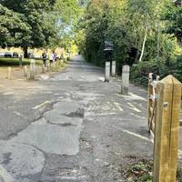 Just after the second bridge, turn left to walk ahead to the right of the car park.