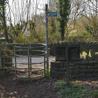 Follow the muddy path along the river until you meet a kissing gate. Turn right over a very busy road bridge  - be careful!