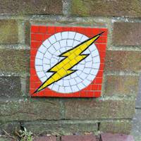 On the wall to your left you may spot The Flash superhero mosaic. These are dotted around the city & are by artist Will Rosie.