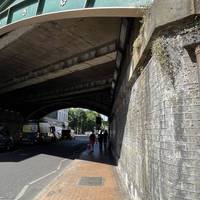 Turn right out of the station and walk under the railway bridge.