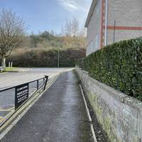 Facing the surgery, head right alongside the car park on Rackvernal Road. There are drop kerbs for level access as you exit the surgery.