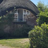 Right from here you’ll find one of the thatched cottages of the village.
