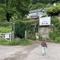 At the junction near the Royal Lodge take a left to find the footpath between hedges alongside the lodge.