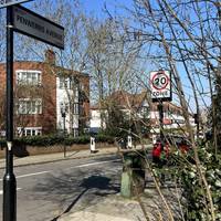 Turn right onto Penwerries Avenue. Enjoy the dappled light from the street trees as you go.