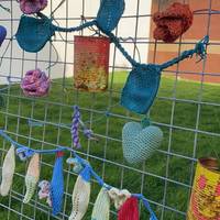 Take a look at their crochet display on the fence of their special green space.