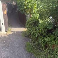 At the end of the single track road you’ll come to a fenced path way. Enter this passage.