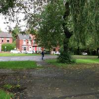 After the visitor centre on the left, take the narrower path straight ahead towards the paved football pitch.