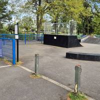 In front of you, the skate park is next to the Tennis and Basketball courts.