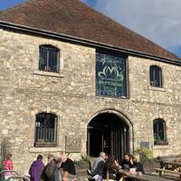 You will pass The Dancing Man Brewery, a popular stop for a pint. The building is an old wool storage house built in the 14th century.