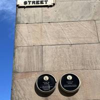 Can you spot the small wall plaques on the side of the Lyceum building?