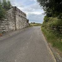 Head down Millburn Road. You’ll see part of an old railway bridge as you head out of the village