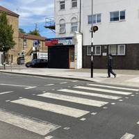Head over the zebra crossing to your right and take a left.