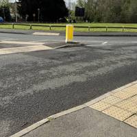 Carefully cross the road leading to the car park