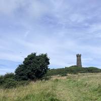 The grass footpath leads to the solid? castellated Agnew Monument. It was built in 1850 in memory of Sir Andrew Agnew of Lochnaw Castle.