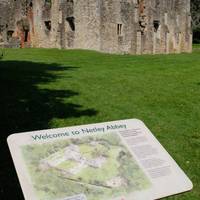 There are a number of information boards around the site to provide you with lots more facts! Continue ahead through the archway to explore.