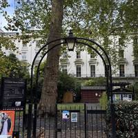 Halfway along Porchester Square, go through the garden gates on the left.