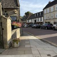 You’ll pass a Catholic Church on the left and a pub across the road on the right.