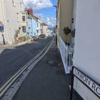 Take the right fork down Sun Hill and look out for your first glimpses of the sea.