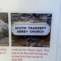 Your first clue is here, on the first information board. Look for the picture that says "SOUTH TRANSEPT ABBEY CHURCH".