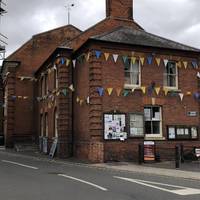 The bunting is around the old Aylsham Townhall, there’s public loos just behind this.