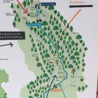 There's a Pay & Display car park with maps showing different length routes to the waterfall